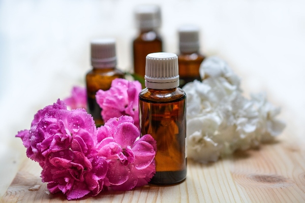 Glass bottles with flowers- DIY magnesium oil recipe